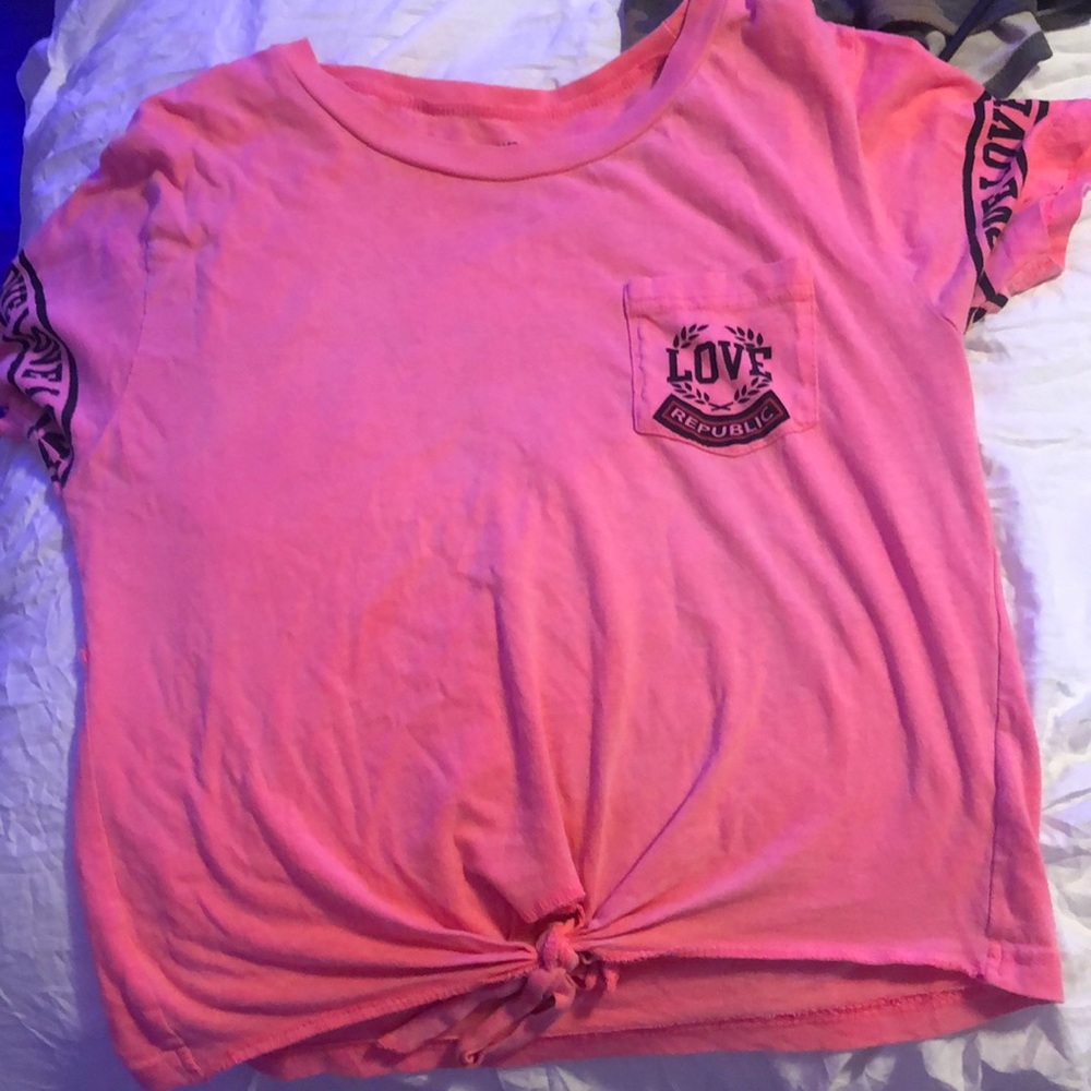 A pink shirt with the word love